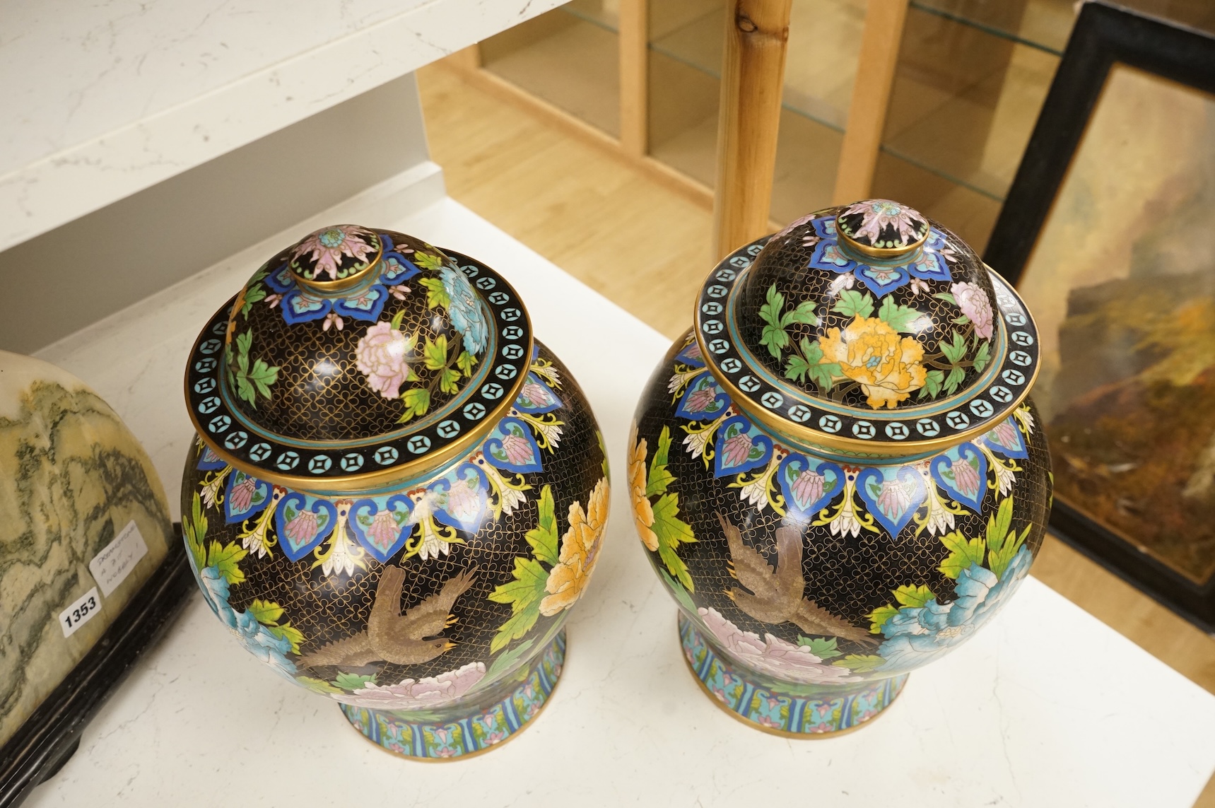 A pair of Chinese cloisonné baluster jars and covers decorated with birds and flowers, 38cm high
